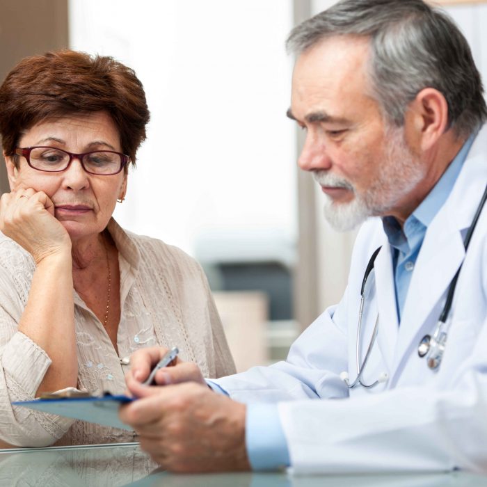 Doctor discussing medical information with patient