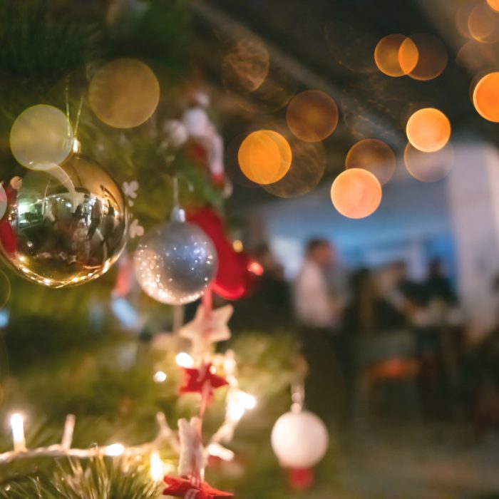 new year and christmas office party close up details food preparing and eating drinks and gifts authentic local startup business team