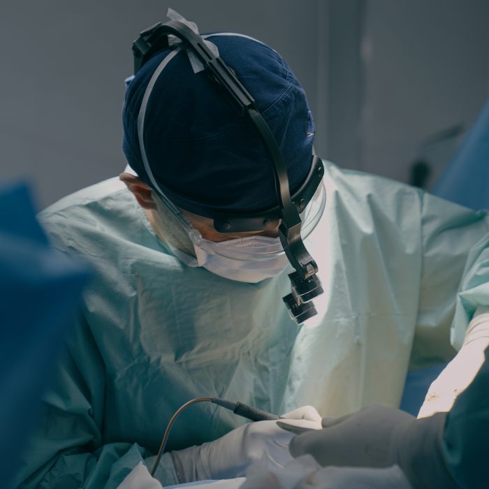 Team surgeons perform operation in operating room professional doctor practitioner using modern medical endoscopic instruments heart surgery remove cancer tumor surgical health procedure in hospital. High quality 4k footage