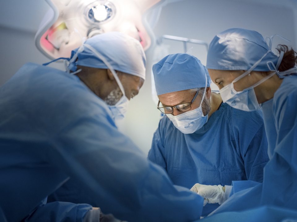 doctors wearing protective scrubs
