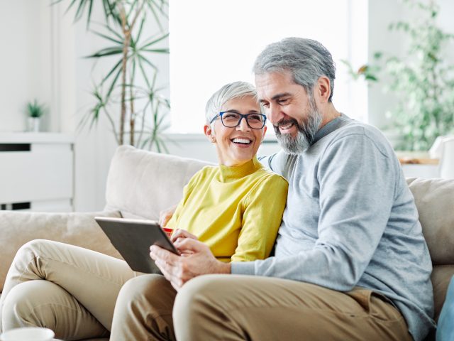 Couple watching tablet