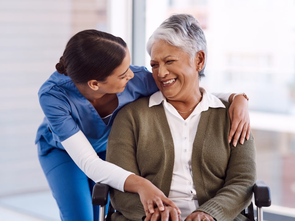 young nurse caring for a senior woman in a wheelchair