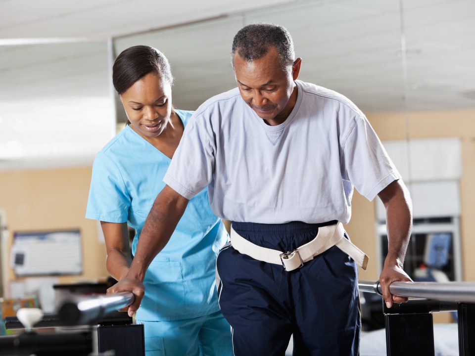 Therapist with patient doing gait training