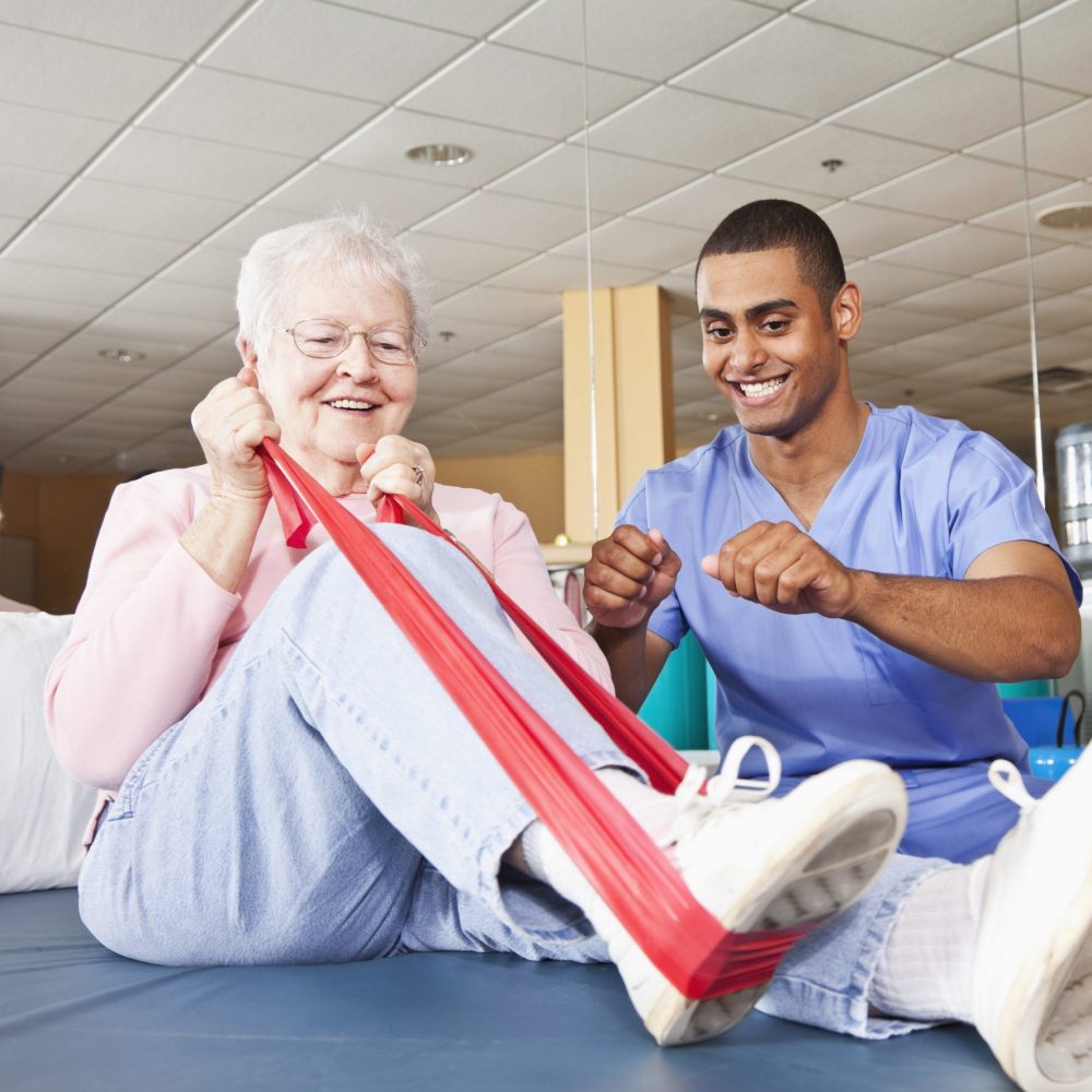 Physical therapist working with patient