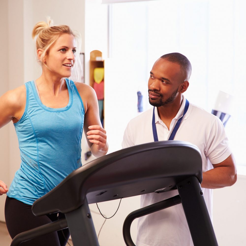 Patient Using Treadmill In Hospital Physiotherapy Department