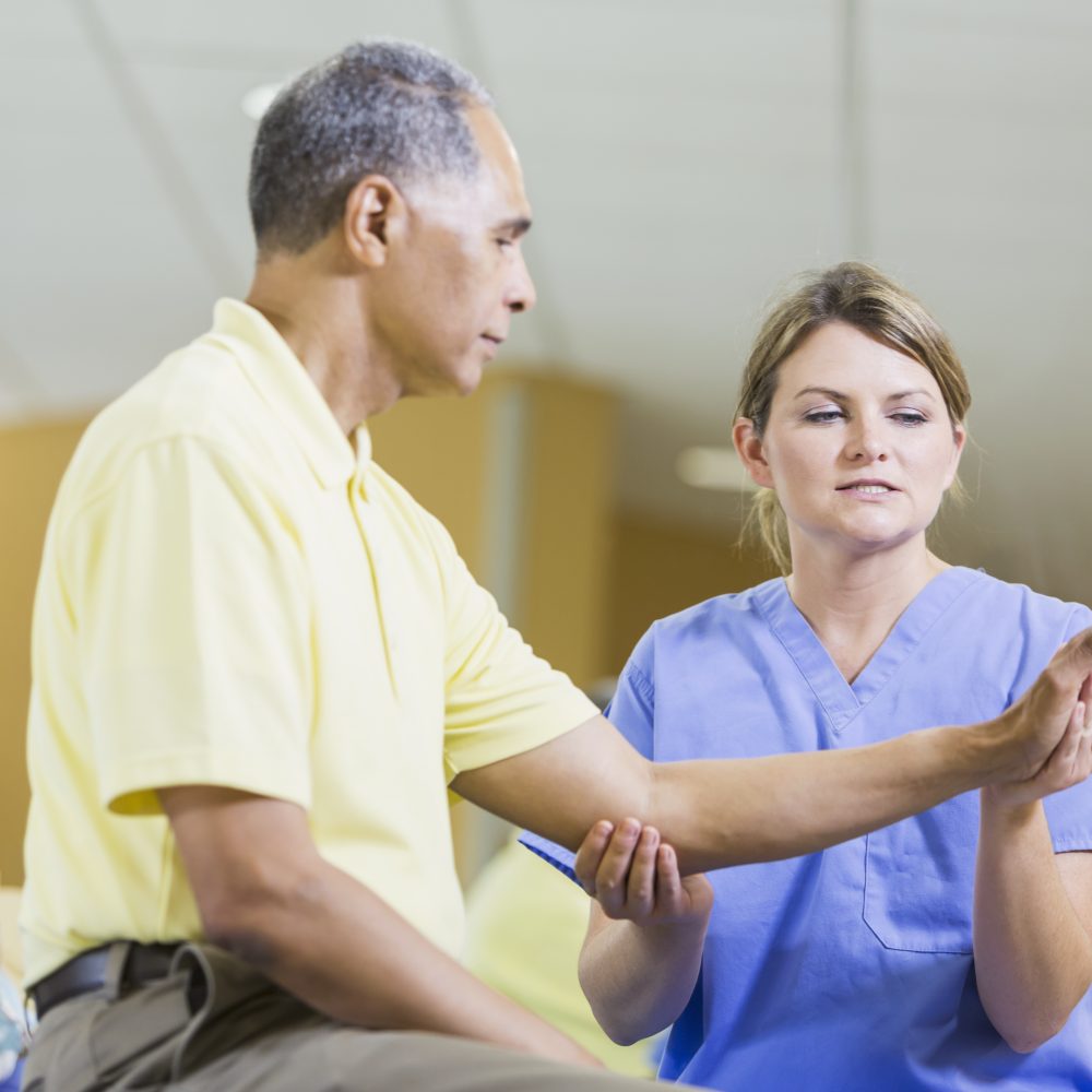 Female physical therapist, African American patient