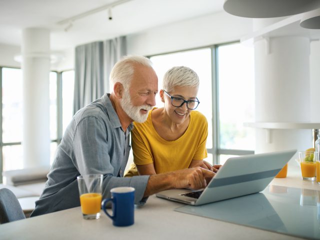 Mature couple on laptop
