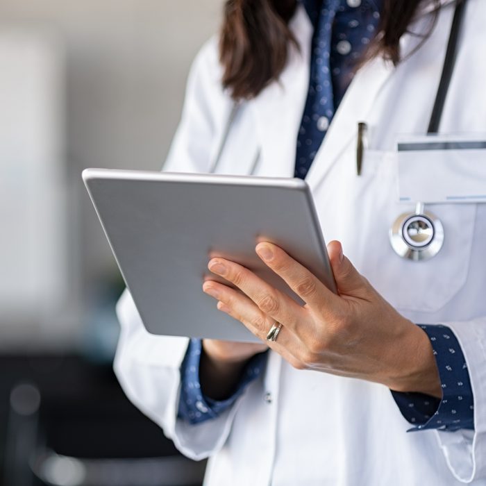 Doctor using digital tablet