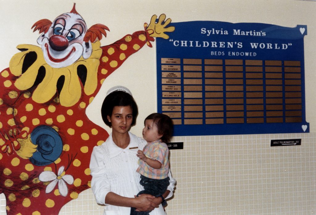 Nurse in child in children's ward