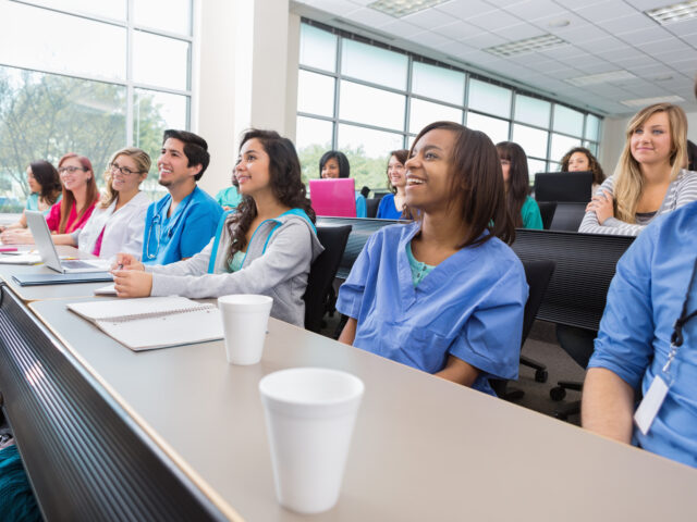 Nursing or medical students listening to professor in lecture hall