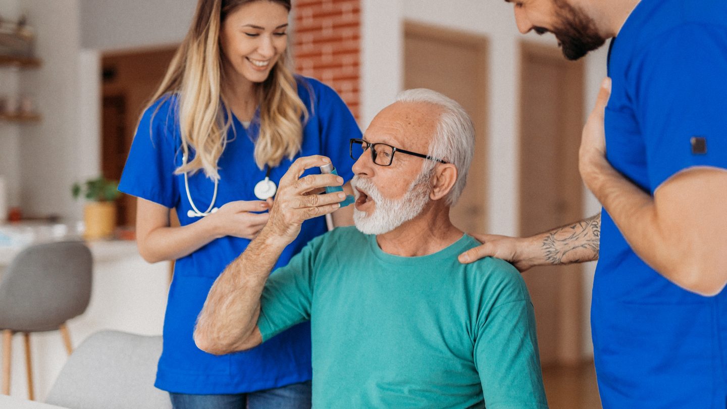 Doctors visiting senior